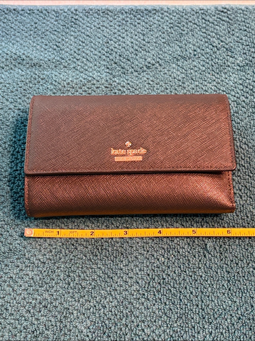 Kate Spade black saffiano tri-fold hand wallet with gold logo